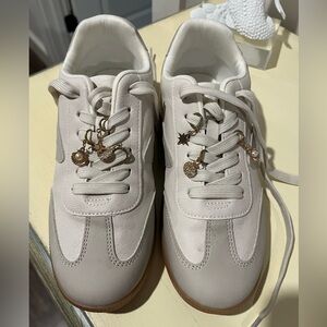 Quantum charm Stylish Cream Sneakers with gold Charm Accents!